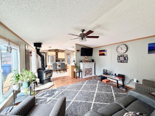 4612 48 Street, Rycroft, AB - Indoor Photo Showing Living Room With Fireplace