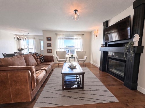 9010 Willow Drive, Grande Prairie, AB - Indoor Photo Showing Living Room With Fireplace