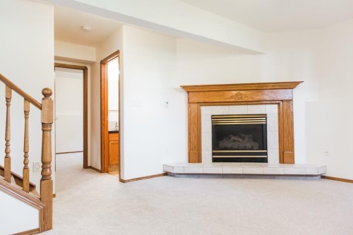 10610 Michaelis Boulevard, Grande Prairie, AB - Indoor Photo Showing Other Room With Fireplace