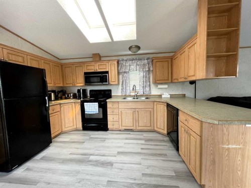 18 Dragonfly Crescent, High Level, AB - Indoor Photo Showing Kitchen With Double Sink