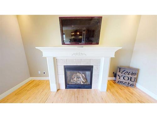 108 Stratton Close Se, Medicine Hat, AB - Indoor Photo Showing Living Room With Fireplace
