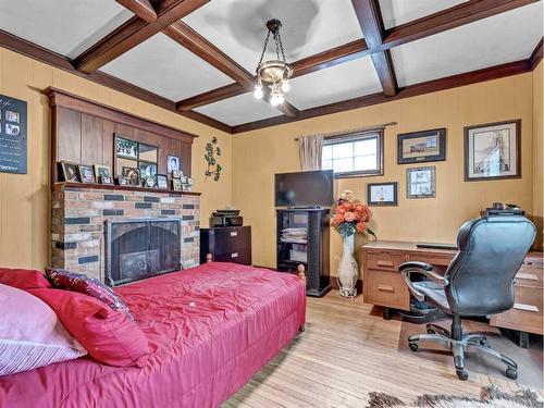 271 1 Street Se, Medicine Hat, AB - Indoor Photo Showing Bedroom With Fireplace