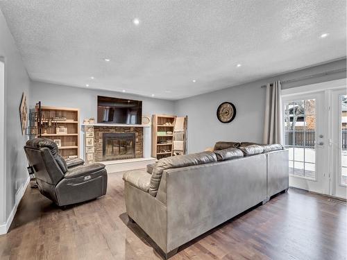 15 Ross View Close Se, Medicine Hat, AB - Indoor Photo Showing Living Room With Fireplace