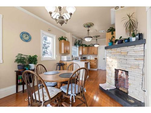 340 5 Street Se, Medicine Hat, AB - Indoor Photo Showing Dining Room With Fireplace
