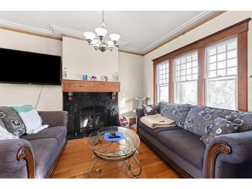 340 5 Street Se, Medicine Hat, AB - Indoor Photo Showing Living Room With Fireplace