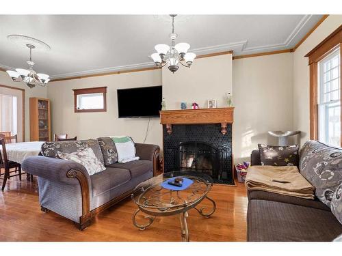 340 5 Street Se, Medicine Hat, AB - Indoor Photo Showing Living Room With Fireplace