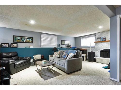 17 Rossdale Drive Se, Medicine Hat, AB - Indoor Photo Showing Living Room With Fireplace