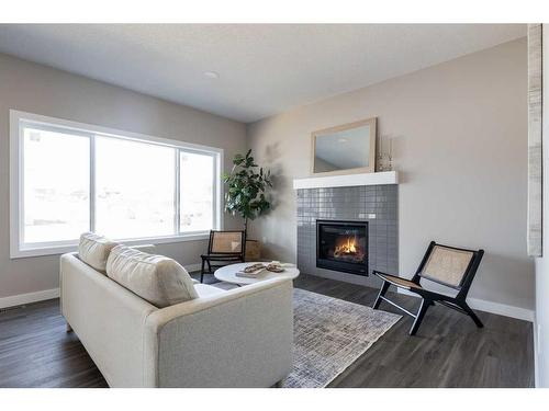 1 Hamptons Gate Se, Medicine Hat, AB - Indoor Photo Showing Living Room With Fireplace
