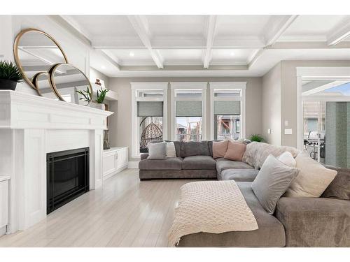 12 Links Place Sw, Desert Blume, AB - Indoor Photo Showing Living Room With Fireplace