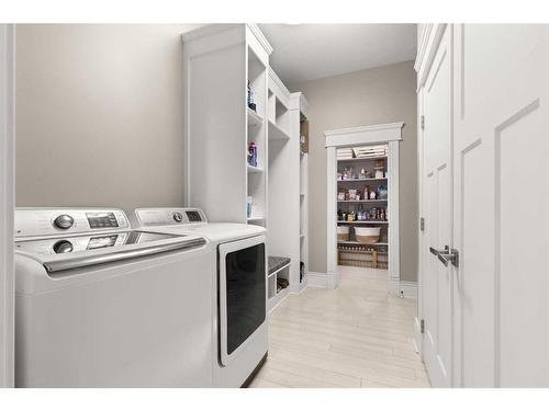 12 Links Place Sw, Desert Blume, AB - Indoor Photo Showing Laundry Room