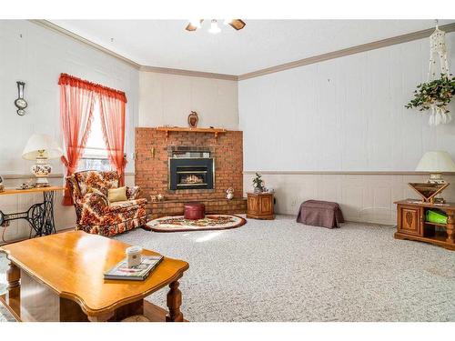 31 4 Street Nw, Redcliff, AB - Indoor Photo Showing Living Room With Fireplace