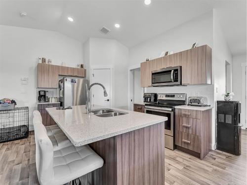 910 9 Avenue Se, Redcliff, AB - Indoor Photo Showing Kitchen With Stainless Steel Kitchen With Double Sink
