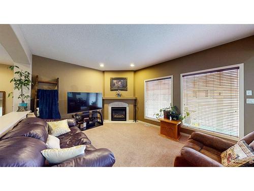 25 Vista Road Se, Medicine Hat, AB - Indoor Photo Showing Living Room With Fireplace