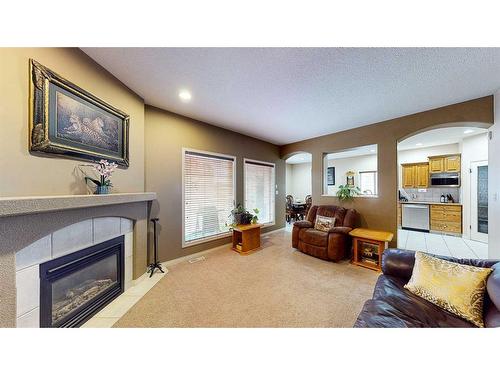 25 Vista Road Se, Medicine Hat, AB - Indoor Photo Showing Living Room With Fireplace