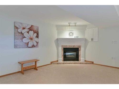 142 Park Meadows Lane Se, Medicine Hat, AB - Indoor Photo Showing Living Room With Fireplace