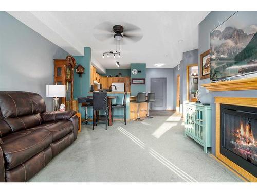 209-29 River Ridge Drive Nw, Medicine Hat, AB - Indoor Photo Showing Living Room With Fireplace