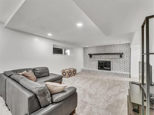606 Ross Glen Drive Se, Medicine Hat, AB - Indoor Photo Showing Other Room With Fireplace