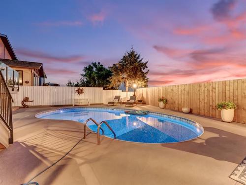606 Ross Glen Drive Se, Medicine Hat, AB - Outdoor With In Ground Pool