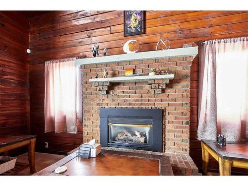 3 12 Avenue Sw, Medicine Hat, AB - Indoor Photo Showing Living Room With Fireplace