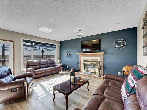 58 Taylor Crescent Se, Medicine Hat, AB - Indoor Photo Showing Living Room With Fireplace