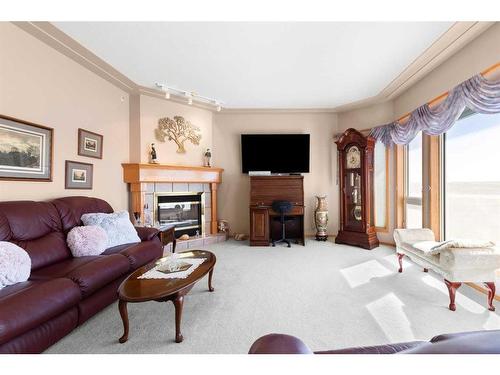 26-3345 10 Avenue Sw, Medicine Hat, AB - Indoor Photo Showing Living Room With Fireplace