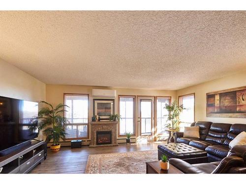 243-1480 Southview Drive Se, Medicine Hat, AB - Indoor Photo Showing Living Room With Fireplace