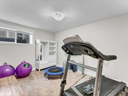 610 Somerside View Se, Medicine Hat, AB - Indoor Photo Showing Gym Room