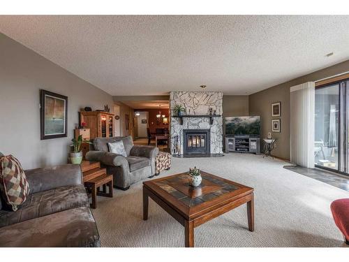 2-1165 16 Street Ne, Medicine Hat, AB - Indoor Photo Showing Living Room With Fireplace