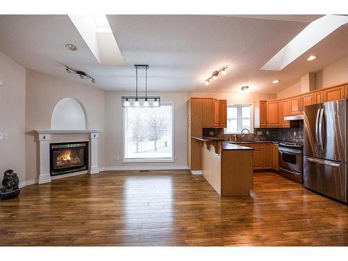 498 Spruce Way Se, Medicine Hat, AB - Indoor Photo Showing Other Room With Fireplace