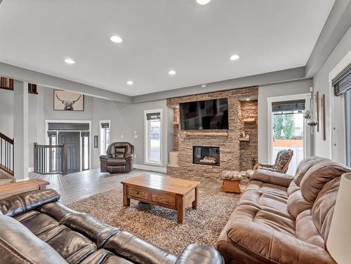 62 Copper Canyon Bay Sw, Medicine Hat, AB - Indoor Photo Showing Living Room With Fireplace