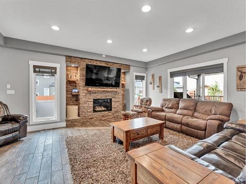62 Copper Canyon Bay Sw, Medicine Hat, AB - Indoor Photo Showing Living Room With Fireplace