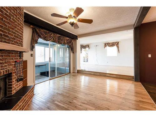 176 1 Street Sw, Medicine Hat, AB - Indoor Photo Showing Other Room With Fireplace