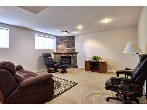 81 Sandstone Place Se, Medicine Hat, AB - Indoor Photo Showing Other Room With Fireplace