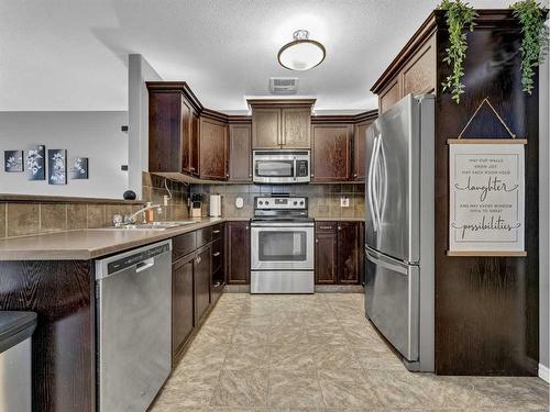 2-315 Somerset Row Se, Medicine Hat, AB - Indoor Photo Showing Kitchen With Stainless Steel Kitchen With Double Sink