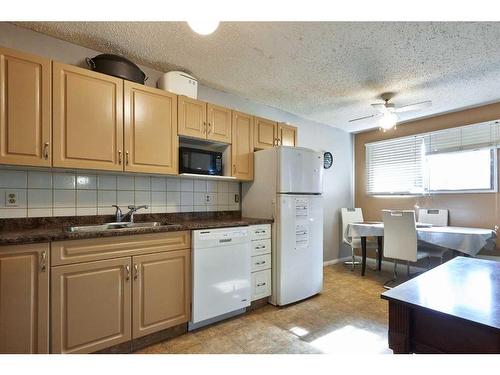 84 Cameron Road Se, Medicine Hat, AB - Indoor Photo Showing Kitchen With Double Sink
