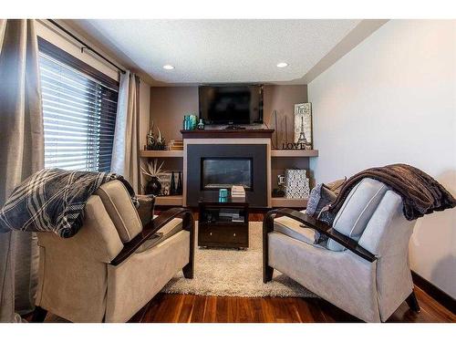 14 Ranchman Court Ne, Medicine Hat, AB - Indoor Photo Showing Living Room With Fireplace