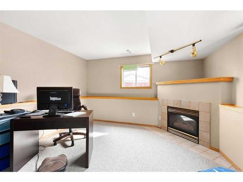 2139 Hawthorne Avenue Ne, Medicine Hat, AB - Indoor Photo Showing Office With Fireplace