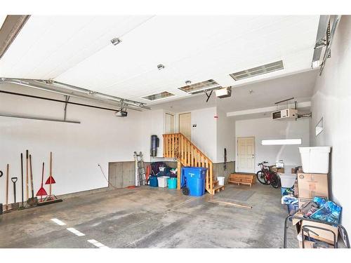 319 Hamptons Way Se, Medicine Hat, AB - Indoor Photo Showing Garage