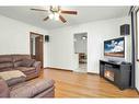 1302 Elm Street Se, Medicine Hat, AB  - Indoor Photo Showing Living Room With Fireplace 