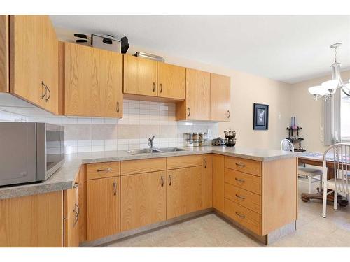 2971 & 2973 Dunmore Road Se, Medicine Hat, AB - Indoor Photo Showing Kitchen With Double Sink