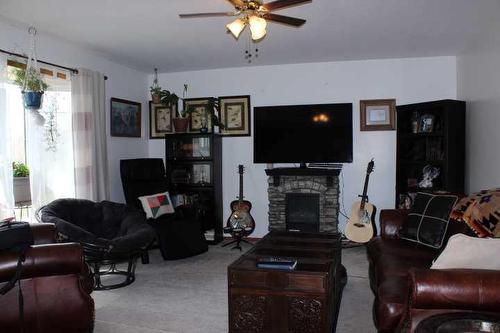 109 Westview Crescent West, Bow Island, AB - Indoor Photo Showing Living Room With Fireplace