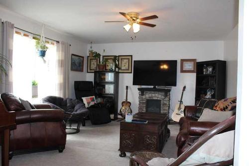 109 Westview Crescent West, Bow Island, AB - Indoor Photo Showing Living Room With Fireplace