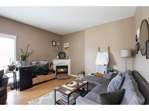 6 Terrace Ridge Ne, Medicine Hat, AB - Indoor Photo Showing Living Room With Fireplace