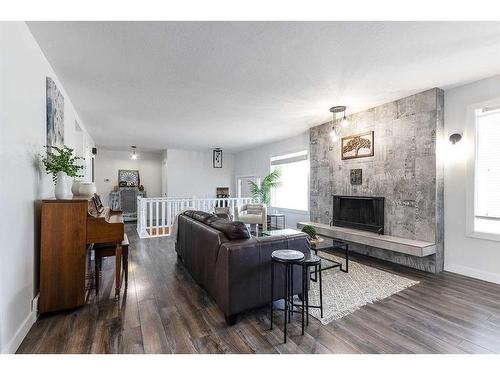 26 Harris Street Sw, Medicine Hat, AB - Indoor Photo Showing Living Room With Fireplace