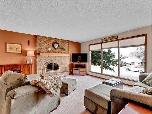 9 Milne Place Se, Medicine Hat, AB - Indoor Photo Showing Living Room With Fireplace