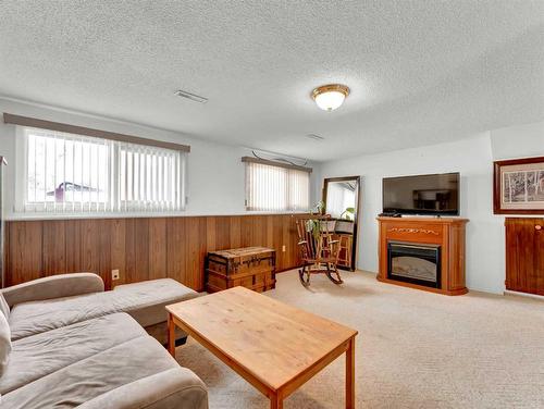 1381 26 Street Se, Medicine Hat, AB - Indoor Photo Showing Living Room With Fireplace