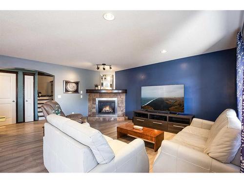 382 Sterling Crescent Se, Medicine Hat, AB - Indoor Photo Showing Living Room With Fireplace