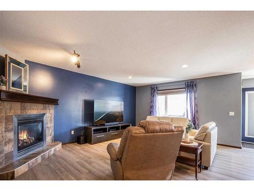 382 Sterling Crescent Se, Medicine Hat, AB - Indoor Photo Showing Living Room With Fireplace
