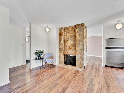 52 Ross Glen Court Se, Medicine Hat, AB - Indoor Photo Showing Living Room With Fireplace