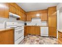 135-1480 Southview Drive Se, Medicine Hat, AB  - Indoor Photo Showing Kitchen With Double Sink 